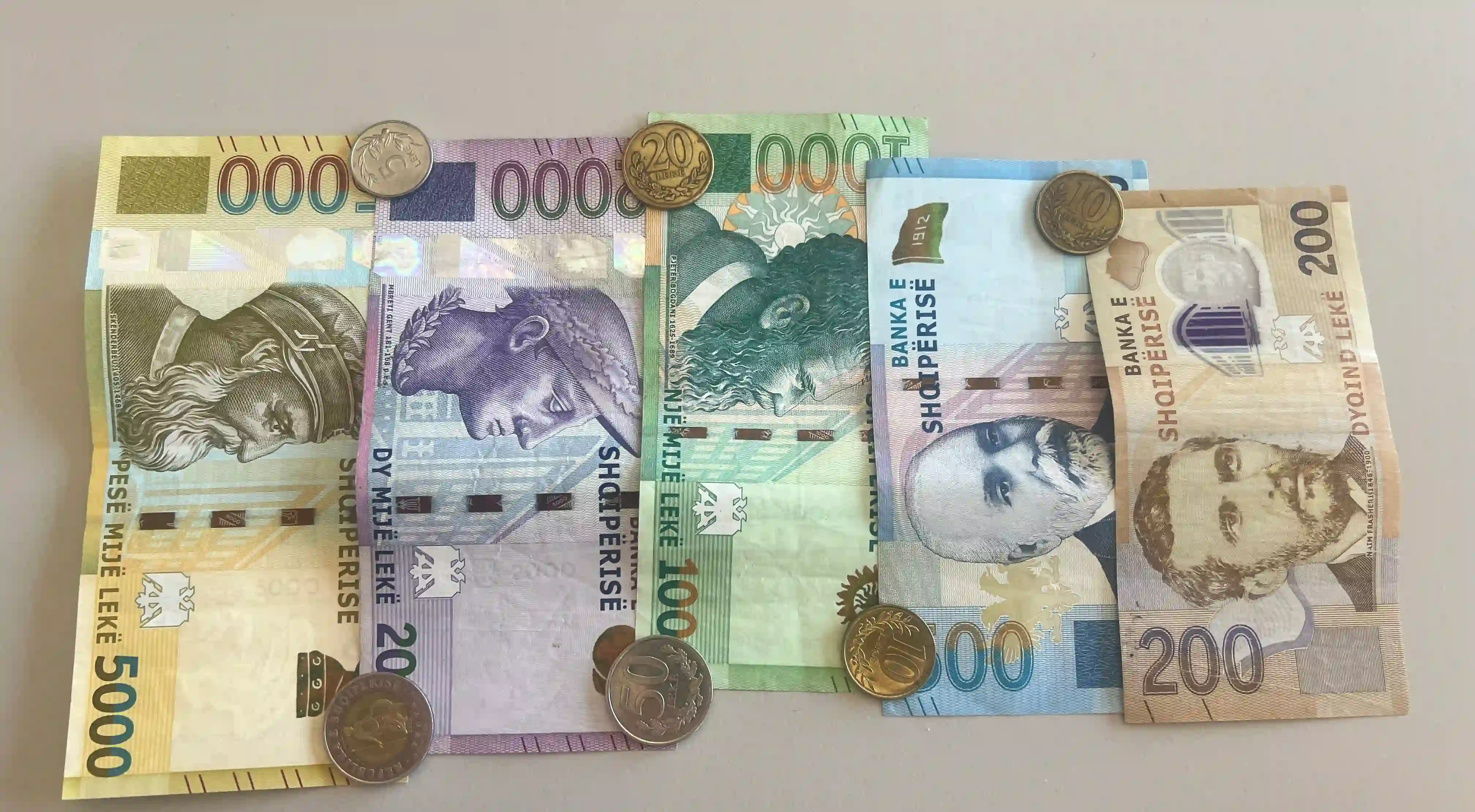 Albanian lek banknotes from 200 to 5,000 lek with coins, the local currency used in Saranda