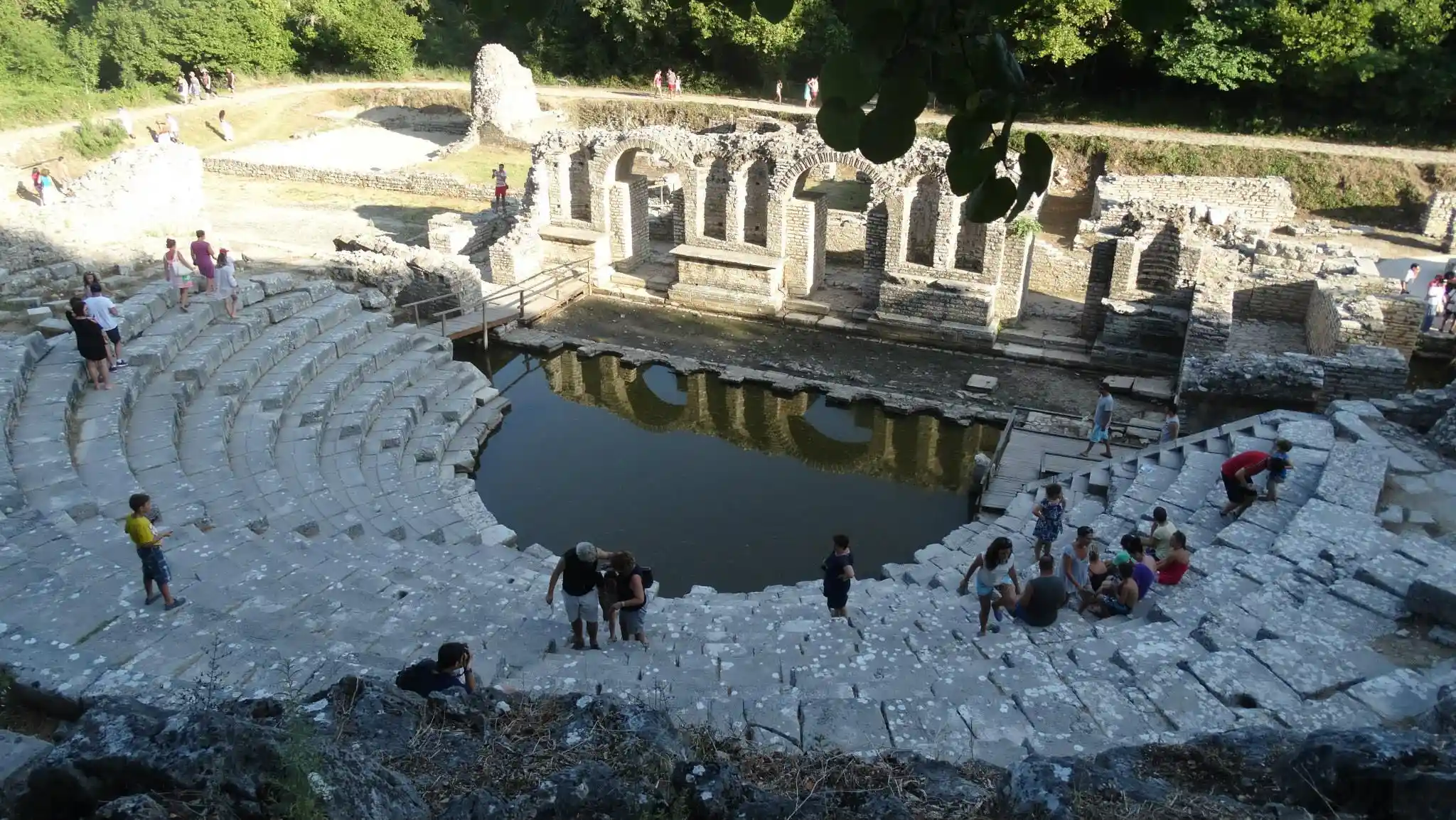 The ancient theatre at Butrint National Park near Saranda, with its water-filled orchestra and stone arches